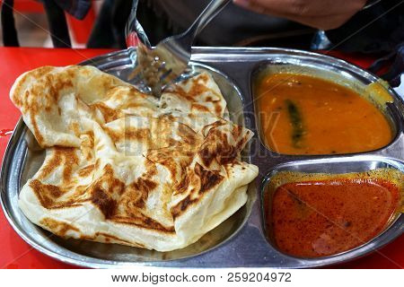 Roti Canai Is An Indian Influenced flatbread Dish Found In Indonesia, Malaysia, Brunei, And Singapor