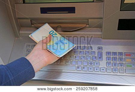 Caucasian Boy Takes European Money At Atm