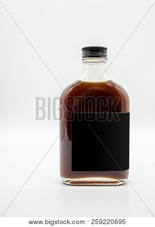 Cold Brew Coffee In Glass Bottle With Black Cap Isolated On White