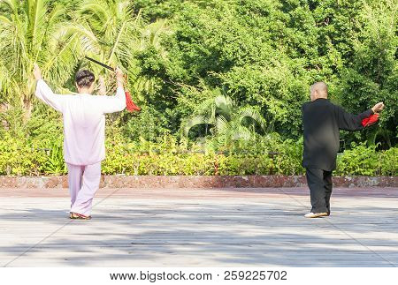 Sanya, China : 11 Nov 2017: Women And  In The Street In The Park Gymnastics Wushu.