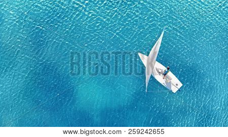 Aerial. Little Sailing Ship On A Crystal Blue Water. Navigation Concept.