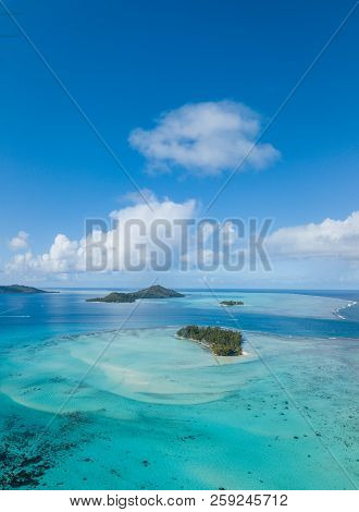 Aerial From A Drone Of Blue Lagoon And Otemanu Mountain At Bora Bora Island, Tahiti, French Polynesi