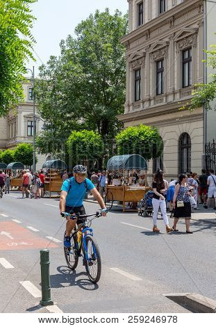 Bucharest, Romania - July 02, 2018: The Pedestrians Cross Calea Victoriei Street In Downtown Buchare