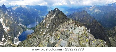 Morskie Oko. High Tatras, Poland, May 27, 2018. Beautiful landscape of snowy mountain tops and the lake between them. View from the mountain Rysy.
