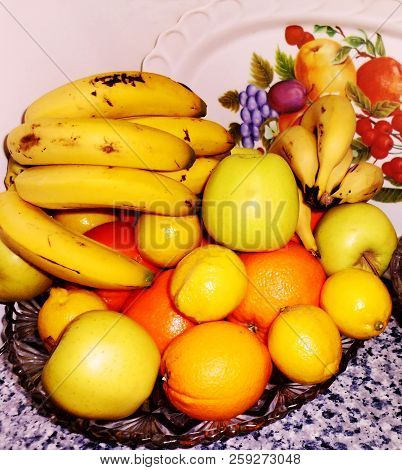 Bodegon Of Oranges, Apples, Bananas And Lemons