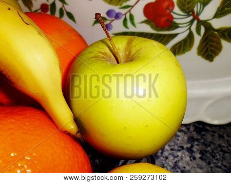 Bodegon Of Oranges, Apples, Bananas And Lemons