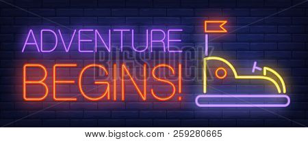 Adventure Begins Neon Text With Bumper Car. Amusement Park And Advertisement Design. Night Bright Ne
