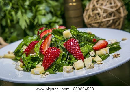 Salad With Summer Fruits And Fresh Vegetables, Closeup