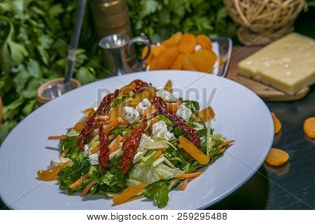 Grape, Blue Cheese, Spinach, Dried Apricots And Cashew Healthy Salad On White Platter On Old Dark Wo
