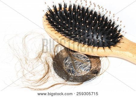 Hair Loss On Washbasin. Long Wet Brown Hair With Wood Brush On White Basin In The Bathroom. Healthca