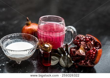 Close Up Of Pomegranate Shrbat Or Juice With Milk,pomegranate Essence,sugar And Raw Pomegranate On W