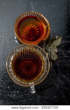 Close Up Of Ingredients Of Green Tea I.e. Honey,sugar And Green Tea Bags On Wooden Surface With Some