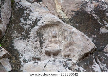 Famous Longmen Grottoes (statues of Buddha and Bodhisattvas carved in the monolith rock near Luoyang in Hennn province, China)
