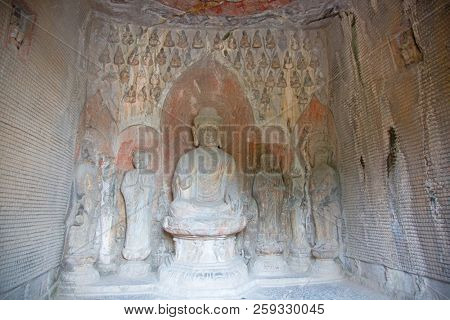 Famous Longmen Grottoes (statues of Buddha and Bodhisattvas carved in the monolith rock near Luoyang in Hennn province, China)