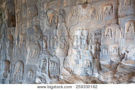 Famous Longmen Grottoes (statues of Buddha and Bodhisattvas carved in the monolith rock near Luoyang in Hennn province, China)