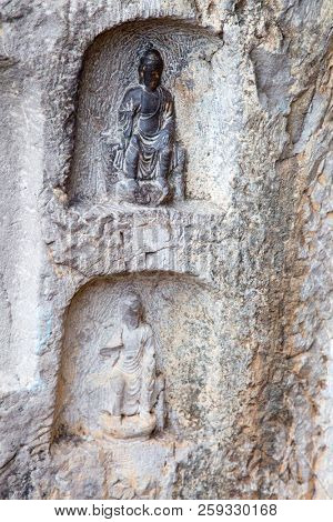 Famous Longmen Grottoes (statues of Buddha and Bodhisattvas carved in the monolith rock near Luoyang in Hennn province, China)