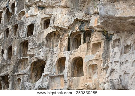 Famous Longmen Grottoes (statues of Buddha and Bodhisattvas carved in the monolith rock near Luoyang in Hennn province, China)