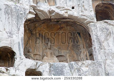 Famous Longmen Grottoes (statues of Buddha and Bodhisattvas carved in the monolith rock near Luoyang in Hennn province, China)