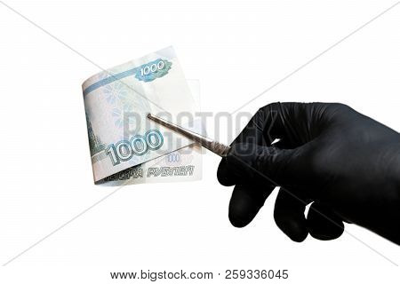 A Close-up Of A Man's Hand In A Black Glove That Holds One Thousand Russian Rubles With Tweezers. Th