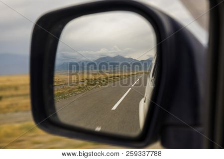 Reflection Of The Road At The Car Side Mirrow.