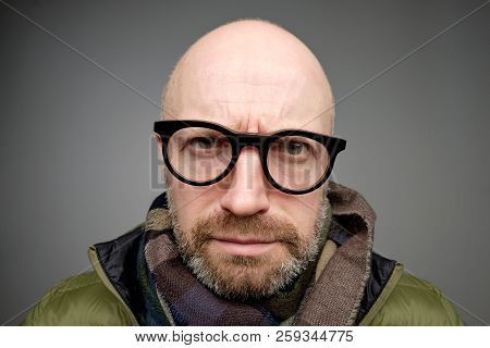 Closeup Portrait Of European Funny Mature Man Thinking Trying Hard To Remember Something Looking Con