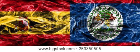 Spain Vs Belize Smoke Flags Placed Side By Side. Thick Colored Silky Smoke Flags Of Spanish And Beli