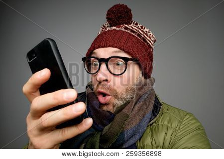 Close Up Portrait Of Funny Young Man Is Surprised And Shocked Confused Reading Text Message
