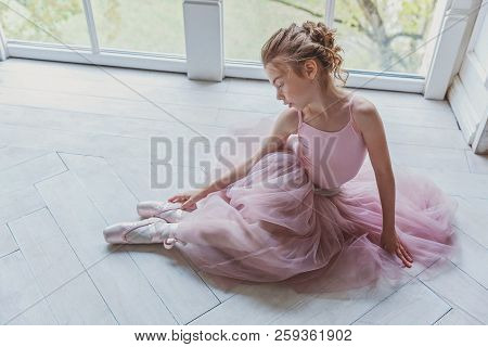 Young Classical Ballet Dancer Girl In Dance Class. Beautiful Graceful Ballerina In Pink Tutu Skirt P