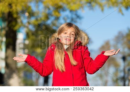 Happy Small Girl In Autumn Park. Small Girl Did It In Mistake. Oops. Even The Wisest Of Us Can Make 