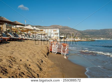 Malia. Crete, Greece - July 1, 2018: Sunbeds At The Beach In Malia On Crete, Greece