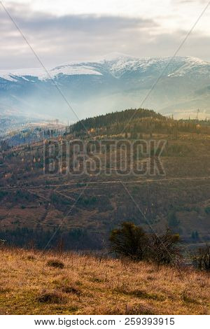 Gloomy November Scenery In Mountains. Foggy And Hazy Forenoon On An Overcast Day. Distant Mountain T