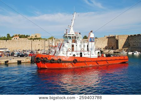 RHODES, GREECE - JUNE 12, 2018: Heracles Star tugboat moored at Kolona port in Rhodes Old Town on the Greek island of Rhodes. The 31mtr vessel was built in 2002 in Greece.