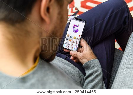 London, Uk - Sep 21, 2018: Man Using The New Ar Memoji Emoji On Apple Iphone Xs With The Immense Ole