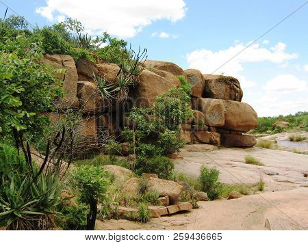 Trail Of Stacked Rocks And Shrubs On Rock Surface Level In Sekhukhune,limpopo,south Africa