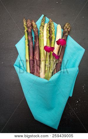 Set Collection Bouquet Purple Green White Asparagus On Black Background. Vegetarian Dieting Organic 