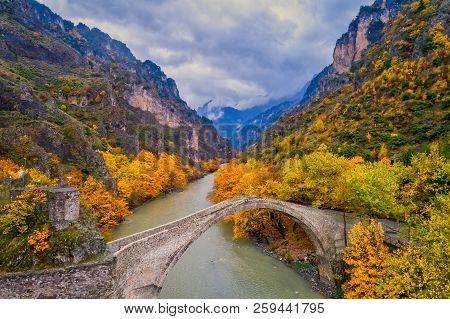 Aerial View Of Konitsa Old Bridge And Aoos River An Autumn Day, Greece.