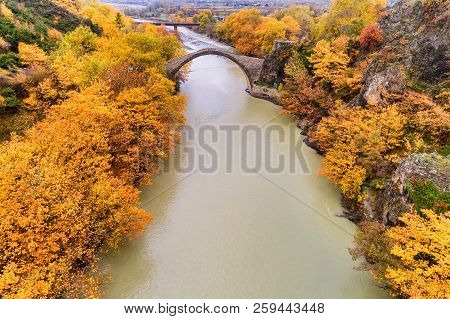 Aerial View Of Konitsa Old Bridge And Aoos River An Autumn Day, Greece.