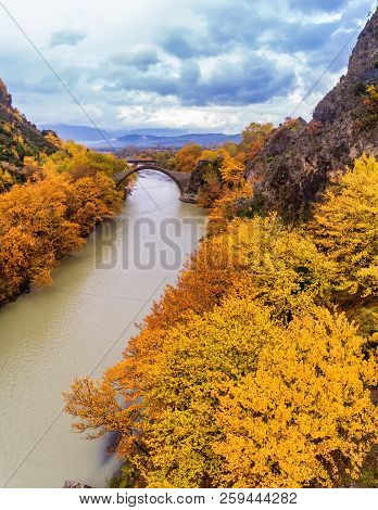 Aerial View Of Konitsa Old Bridge And Aoos River An Autumn Day, Greece.