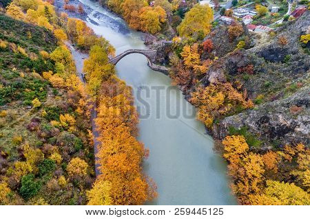 Aerial View Of Konitsa Old Bridge And Aoos River An Autumn Day, Greece.