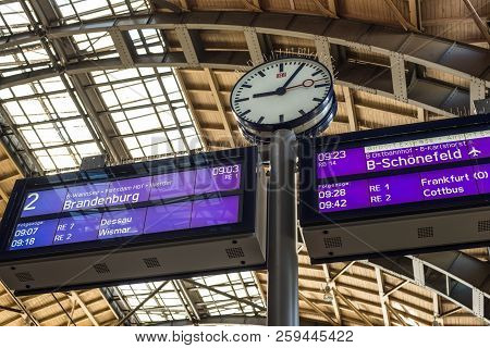 Berlin, Germany - May 28, 2017: Clock And Train Departure Timetable Display In A Railway Station In 