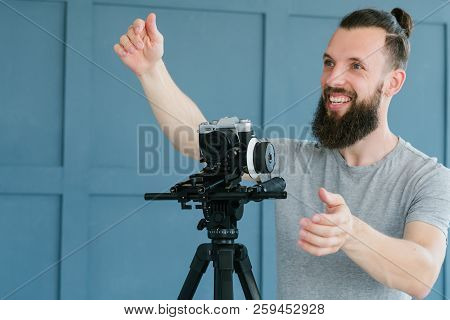 Video Content Creation Process. Cameraman Shooting Footage For Vlog Broadcast Or Report And Giving I