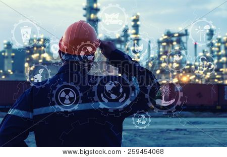 Engineer Is Standing On Large Industry Background.