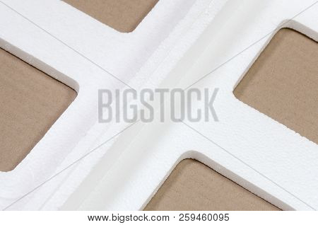 Background Image With Beige Cardboard Paper And Styrofoam Boxes Disgarded As Rubbish. The Concept Of