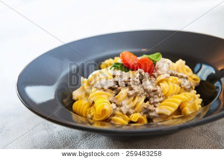 Radiatori pasta in a creamy tomato parmesan cheese sauce
