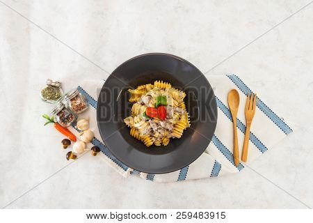 Radiatori pasta in a creamy tomato parmesan cheese sauce