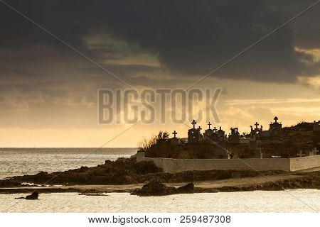 Agios Fokas Near Monemvasia In Stormy Weather Overcast Sky, Sunrise. Small Cemetery On Sea Shore, Ma