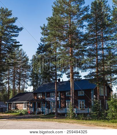 Overkalix, Sweden - July 27, 2018: Wooden Hotel At The Polcirkeln Stop Near The Arctic Circle Board 