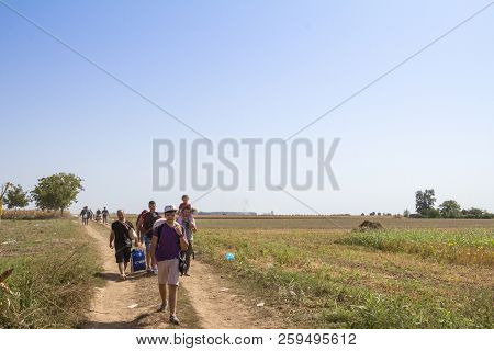 Tovarnik, Croatia - September 19, 2015: Refugees Walking Through The Fields Near The Croatia Serbia 