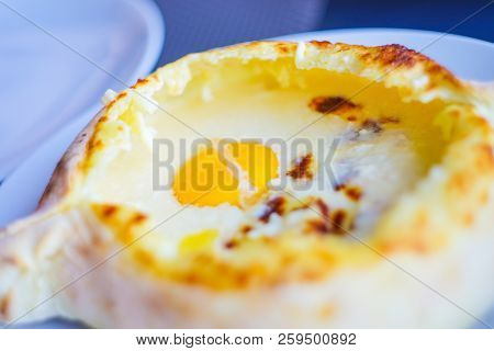 Ajarian Or Adjaruli Khachapuri, Filled With Cheese And Topped With A Raw Egg And Butter - Traditiona