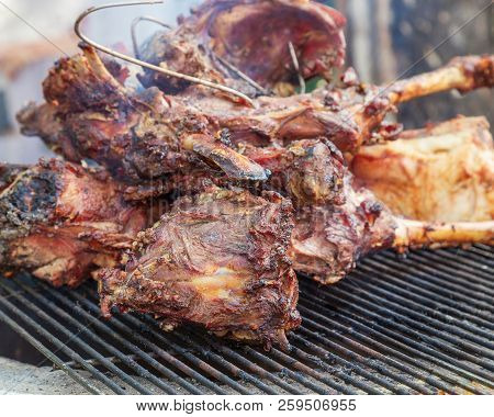 Large Pieces Of Fried Lamb Cooked In Tandoor. Appetizingly Cooked Meat. Traditional Oriental Cuisine